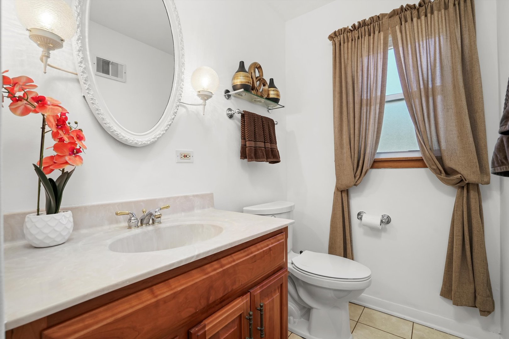 2130 Birch Street Park Ridge, IL 60068 - Photo 31 of 47 a bathroom with a sink vanity mirror and toilet