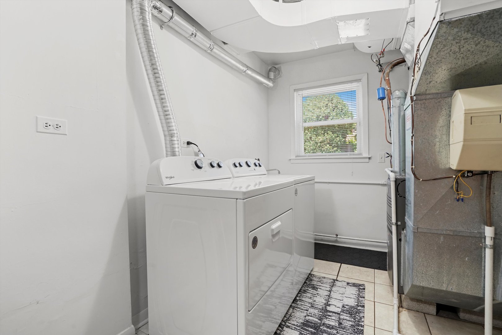 2130 Birch Street Park Ridge, IL 60068 - Photo 33 of 47 a utility room with cabinets washer and dryer