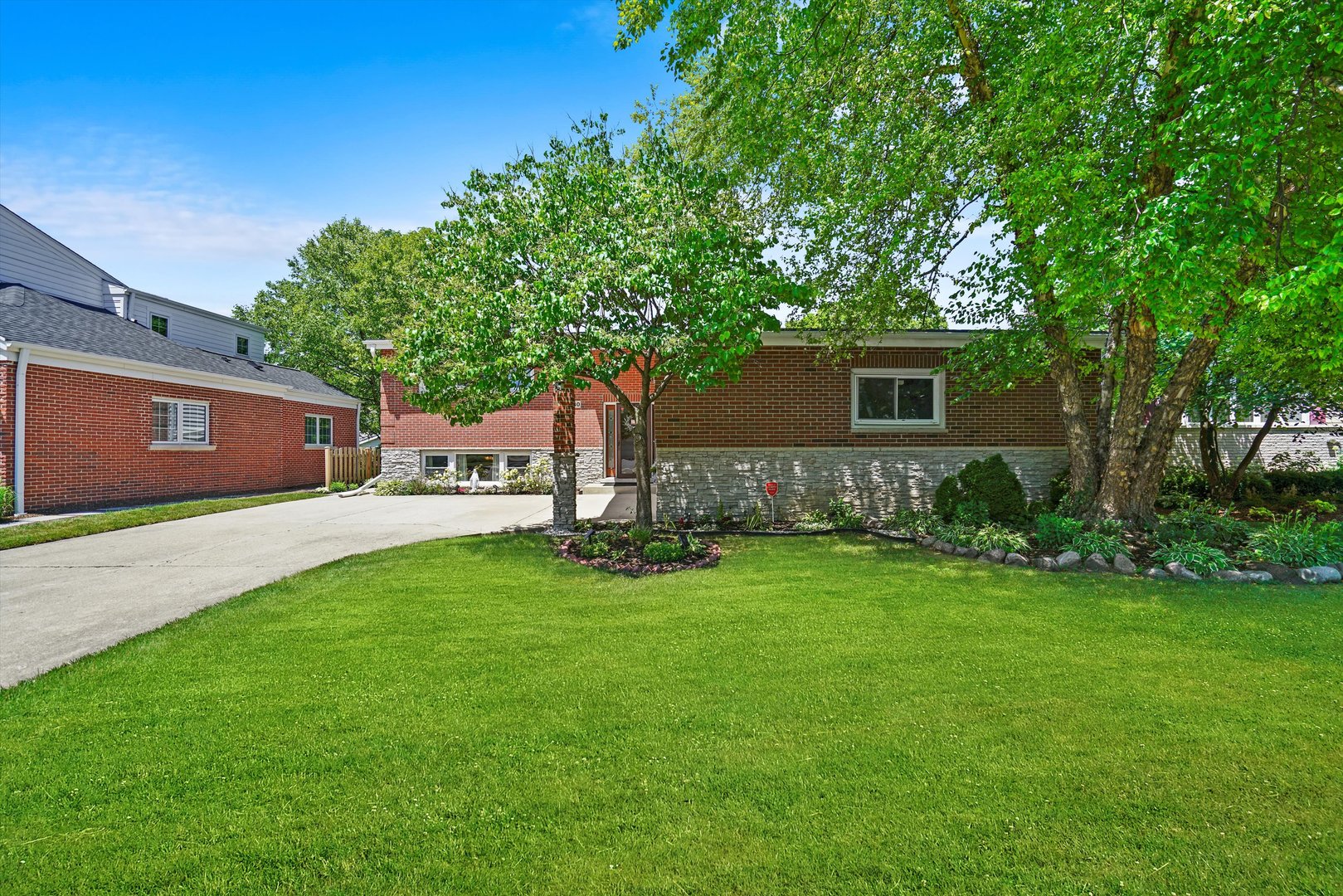 2130 Birch Street Park Ridge, IL 60068 - Photo 41 of 47 a front view of a house with garden