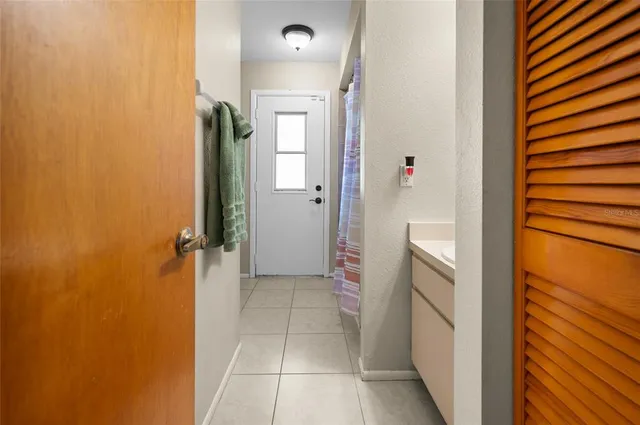 a bathroom with a shower and a sink