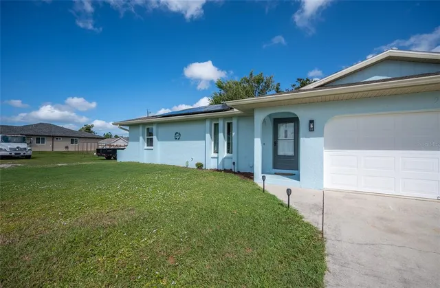 a view of a house with a yard