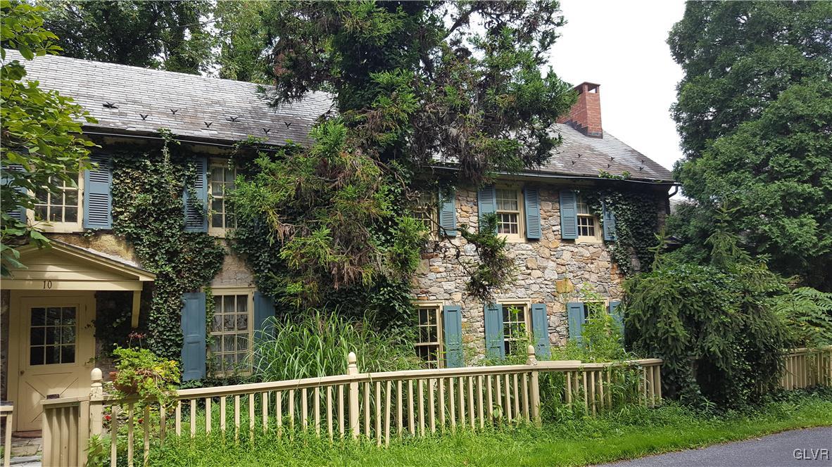10 Stouts Valley Road Easton, PA 18042 - Photo 1 of 35 a view of a house with brick walls plants and large trees