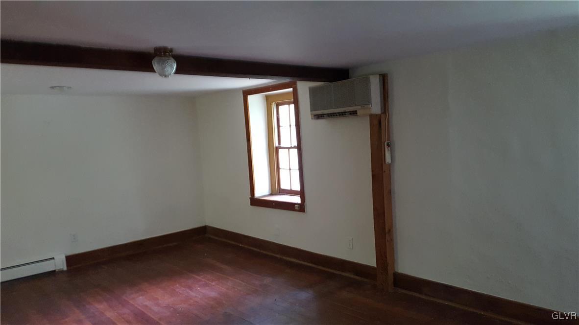 10 Stouts Valley Road Easton, PA 18042 - Photo 18 of 35 an empty room with wooden floor and windows
