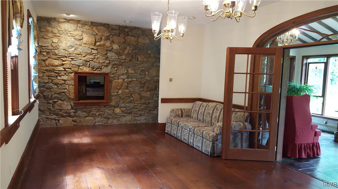 10 Stouts Valley Road Easton, PA 18042 - Photo 20 of 35 a view of a livingroom with furniture wooden floor chandelier and front door
