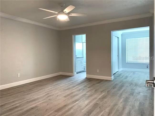 2451 Canadian Way, Unit 59 Clearwater, FL 33763 - Photo 15 of 58 wooden floor in an empty room