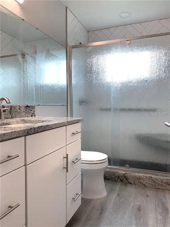 2451 Canadian Way, Unit 59 Clearwater, FL 33763 - Photo 16 of 58 a bathroom with a sink toilet and shower