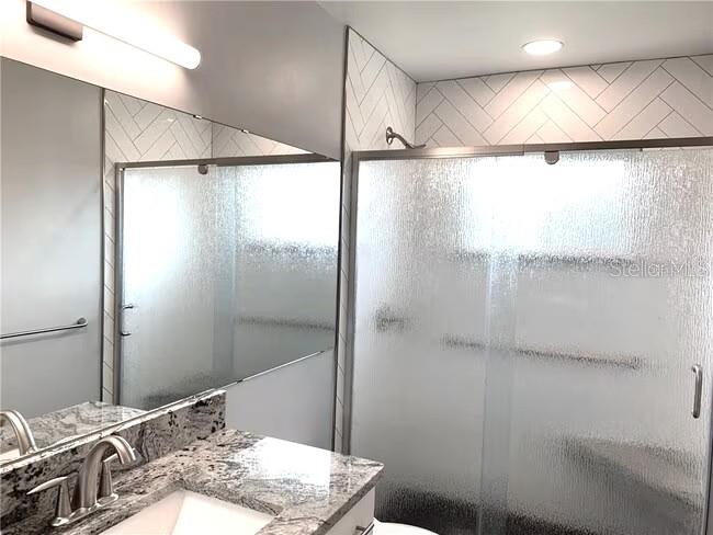 2451 Canadian Way, Unit 59 Clearwater, FL 33763 - Photo 17 of 58 a bathroom with a sink and a mirror