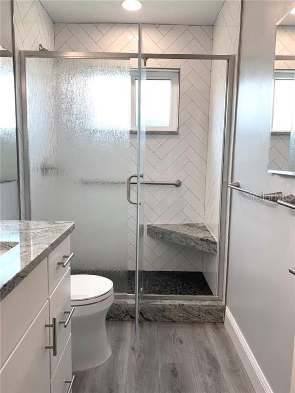 2451 Canadian Way, Unit 59 Clearwater, FL 33763 - Photo 19 of 58 a bathroom with a toilet and a shower