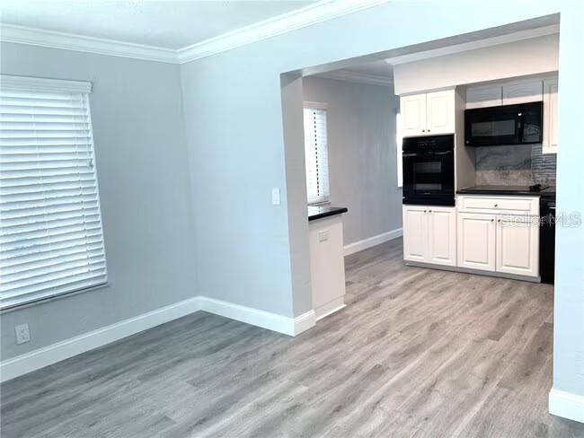 2451 Canadian Way, Unit 59 Clearwater, FL 33763 - Photo 23 of 58 a view of a livingroom with an empty space and a window