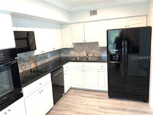 2451 Canadian Way, Unit 59 Clearwater, FL 33763 - Photo 27 of 58 a kitchen with a sink and a refrigerator