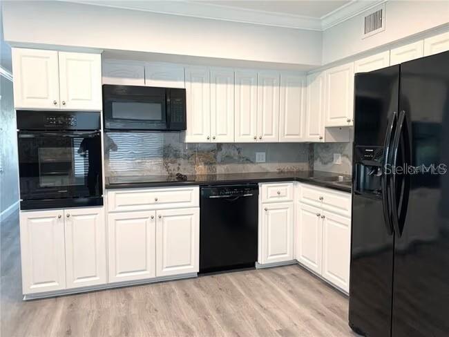 2451 Canadian Way, Unit 59 Clearwater, FL 33763 - Photo 29 of 58 a kitchen with granite countertop a refrigerator sink and microwave