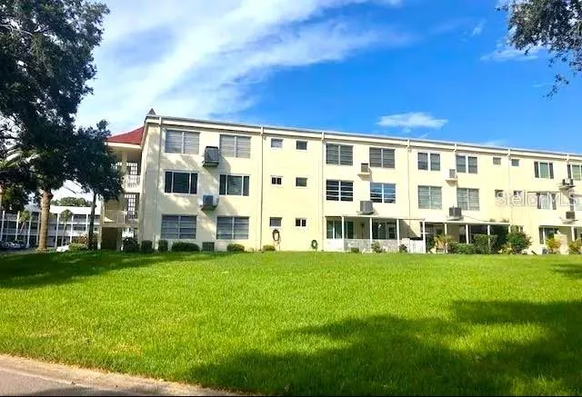 a view of car parked in front of building