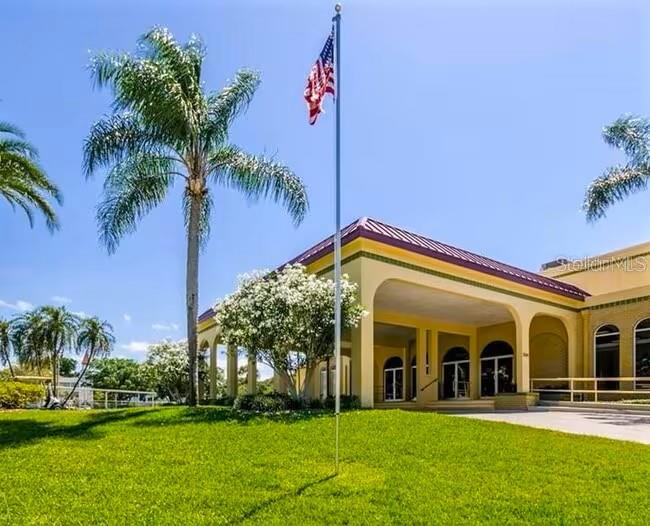 2451 Canadian Way, Unit 59 Clearwater, FL 33763 - Photo 35 of 58 a view of a building with a swimming pool