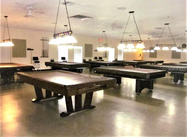 2451 Canadian Way, Unit 59 Clearwater, FL 33763 - Photo 37 of 58 a room with lots of wooden furniture