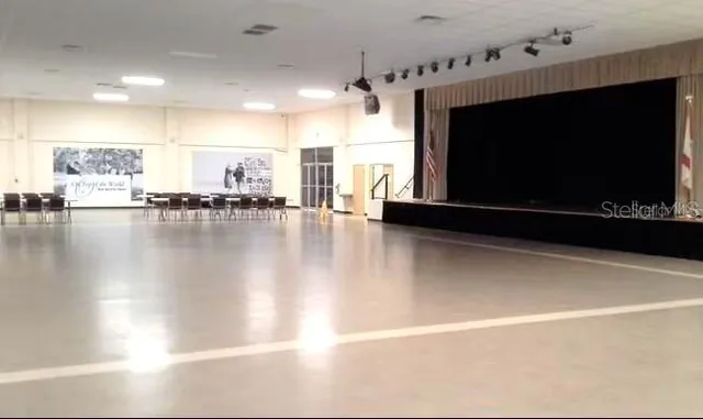 a view of a swimming pool with an outdoor space and seating area