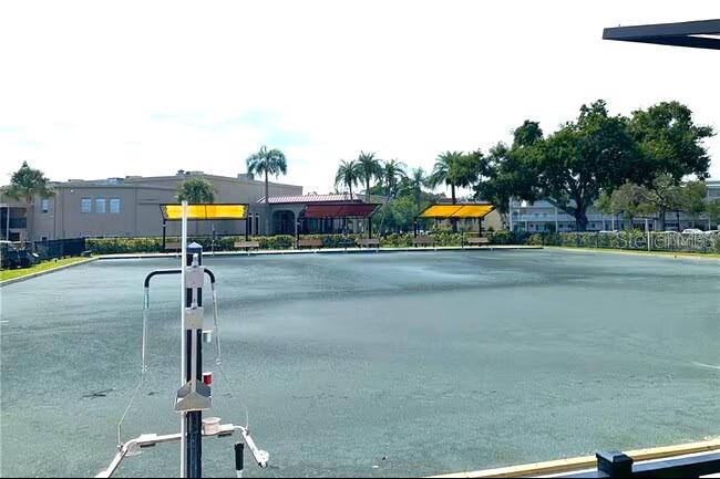 2451 Canadian Way, Unit 59 Clearwater, FL 33763 - Photo 50 of 58 a street sign on a sidewalk next to a road