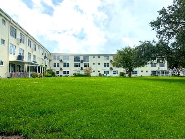 2451 Canadian Way, Unit 59 Clearwater, FL 33763 - Photo 57 of 58 a view of building with garden