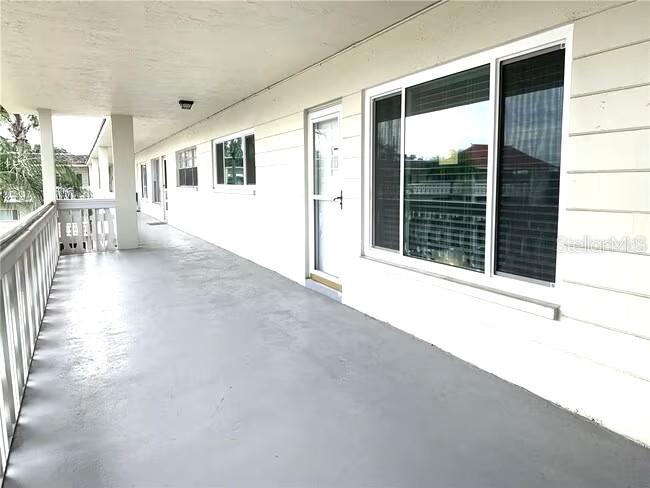 2451 Canadian Way, Unit 59 Clearwater, FL 33763 - Photo 8 of 58 a view of a house with a porch