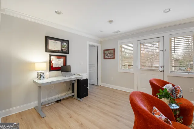 a bedroom with a bed and a lamp on table