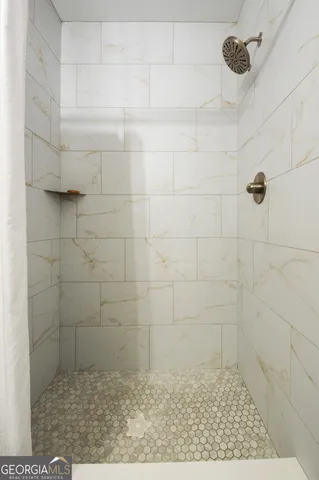 a view of a porch with a table and chairs