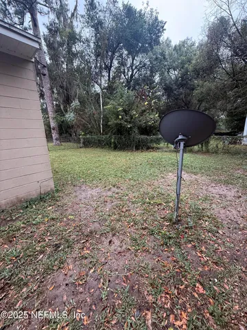 a backyard of a house with lots of green space