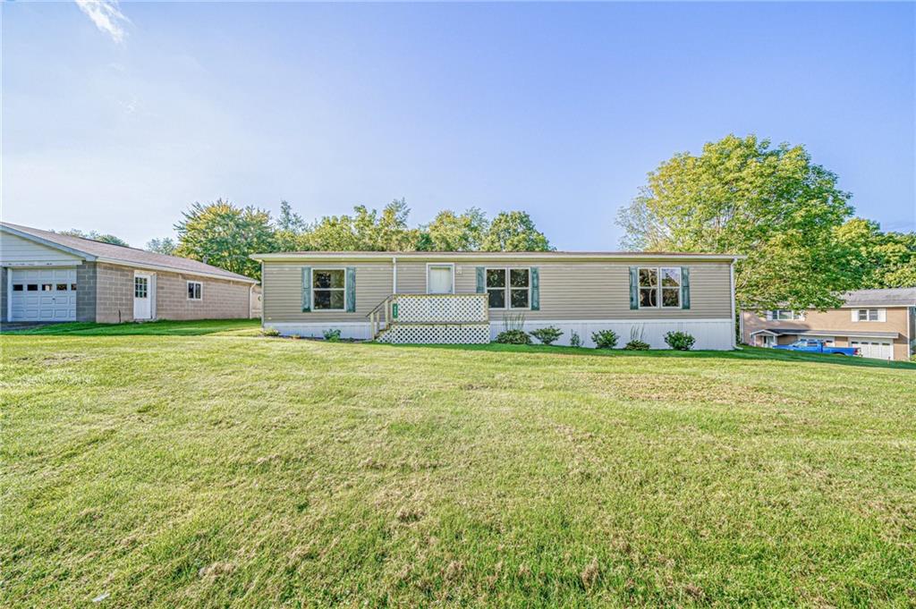 863 Anderson Creek Road Kittanning, PA 16201 - Photo 1 of 24 a front view of house with yard and seating area