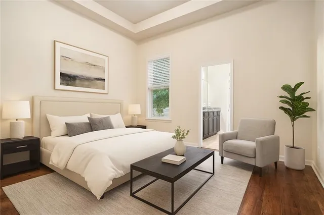 a bedroom with a bed and a couch