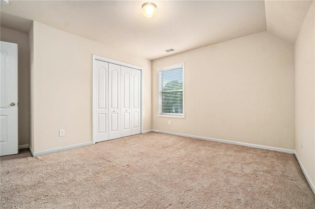 1736 Walton Reserve Way Austell, GA 30168 - Photo 22 of 35 an empty room with windows