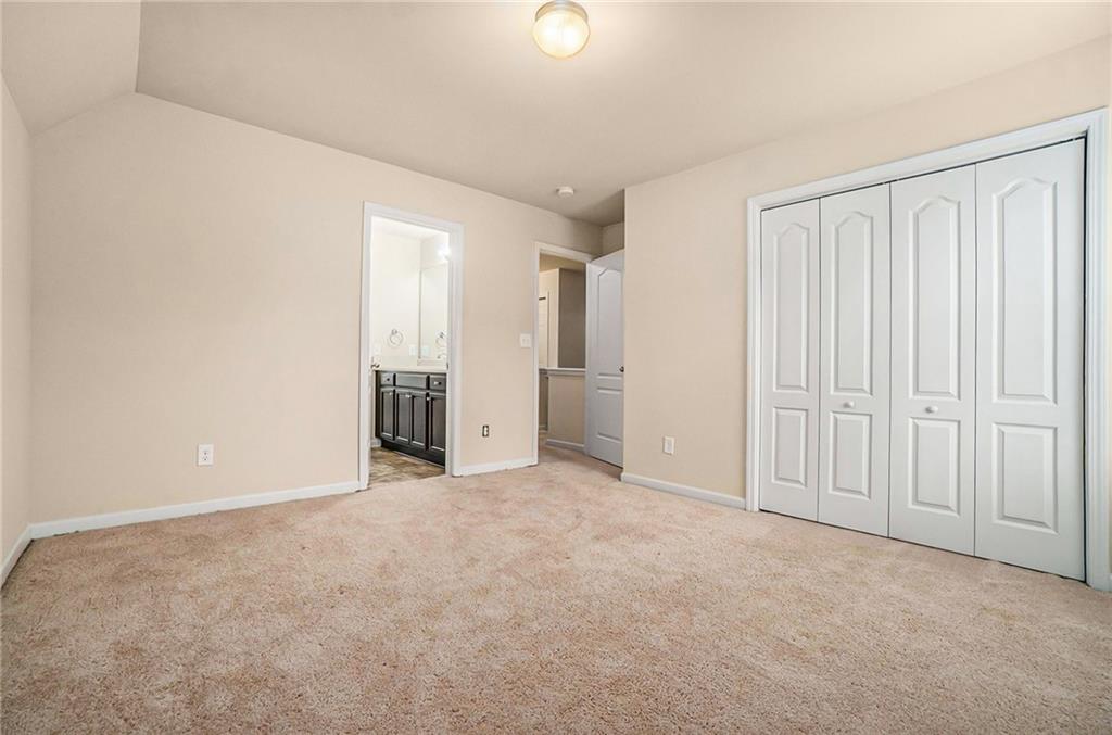 1736 Walton Reserve Way Austell, GA 30168 - Photo 23 of 35 an empty room with windows and closet
