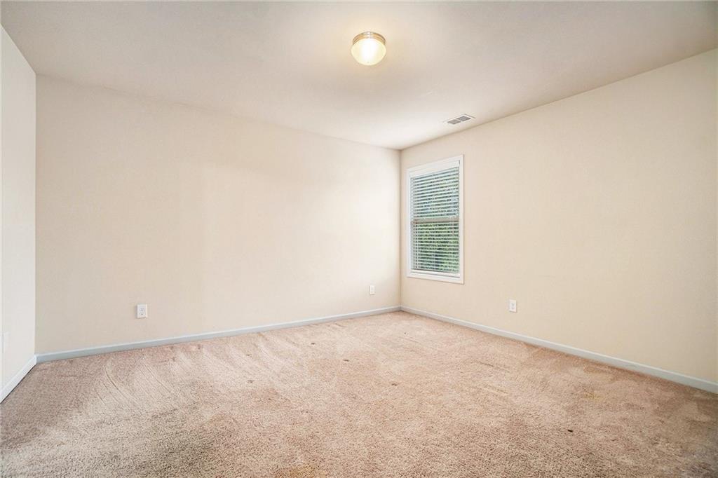 1736 Walton Reserve Way Austell, GA 30168 - Photo 25 of 35 an empty room with a window