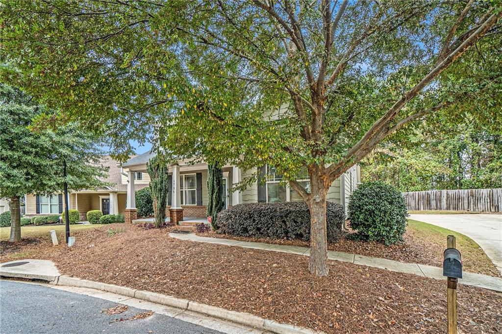 1736 Walton Reserve Way Austell, GA 30168 - Photo 3 of 35 a front view of a house with garden