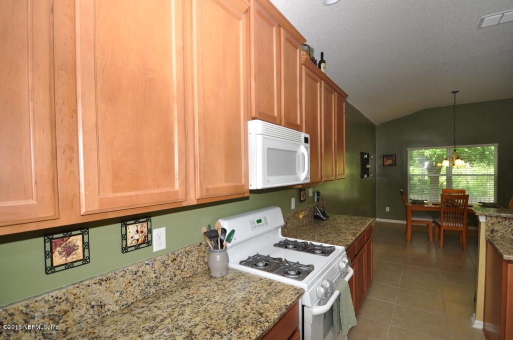 14462 Millhopper Road Jacksonville, FL 32258 - Photo 16 of 54 Kitchen Cabinets and Gas Stove