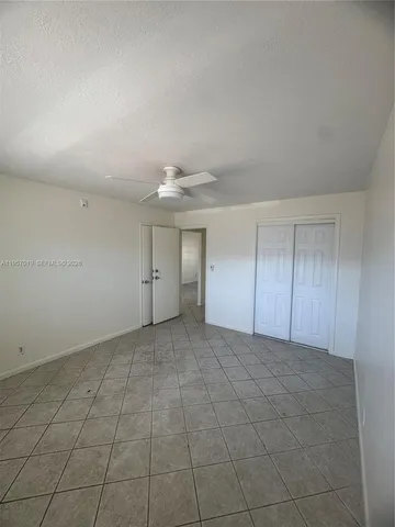 a view of a hallway with staircase