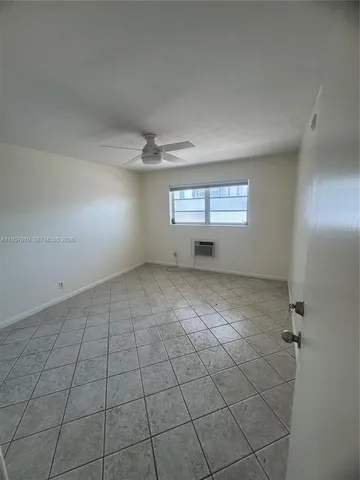 a bathroom with a toilet sink and a mirror