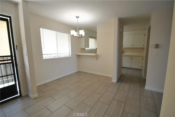 a kitchen with stainless steel appliances a refrigerator sink and cabinets