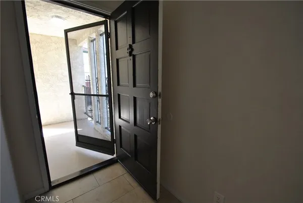 a kitchen with a sink cabinets and a window