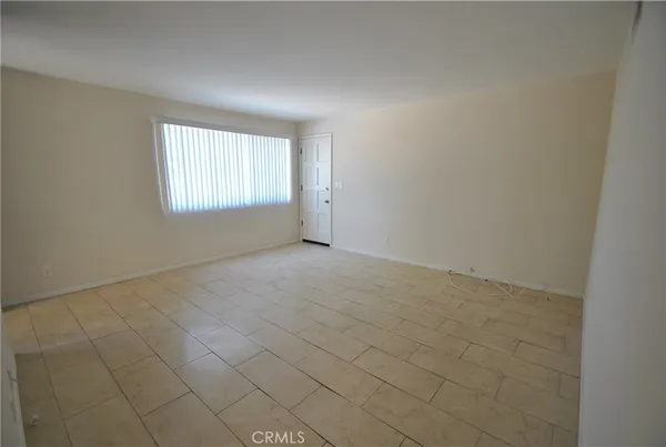 a kitchen with granite countertop a stove sink and cabinets