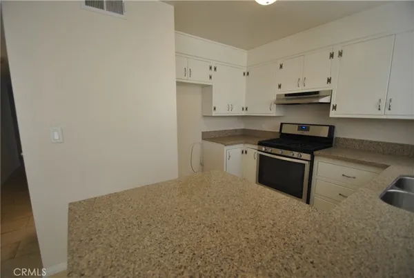 an empty room that has a window in it