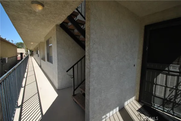 a view of staircase and utility room