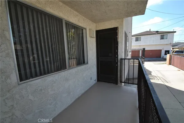 a view of a balcony with furniture and a fireplace