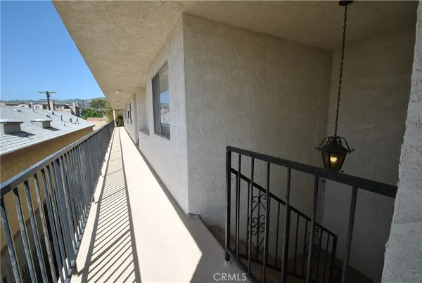 a bathroom with a granite countertop toilet and a shower