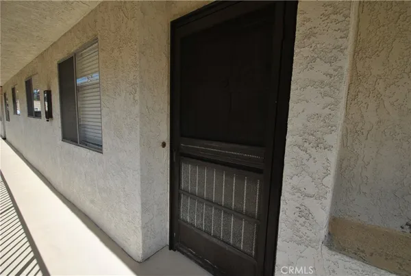 an empty room with large windows