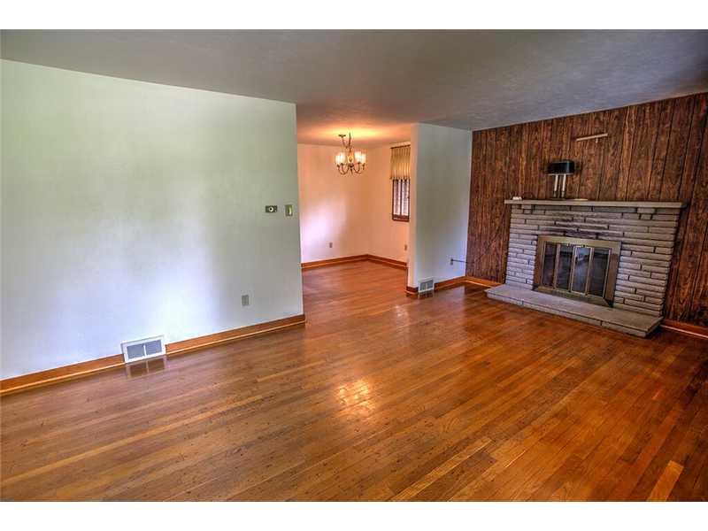 2201 Ridge Road McKeesport, PA 15135 - Photo 2 of 19 Living Room. The living room features hardwood floors and a stone log burning fireplace. Freshly painted.