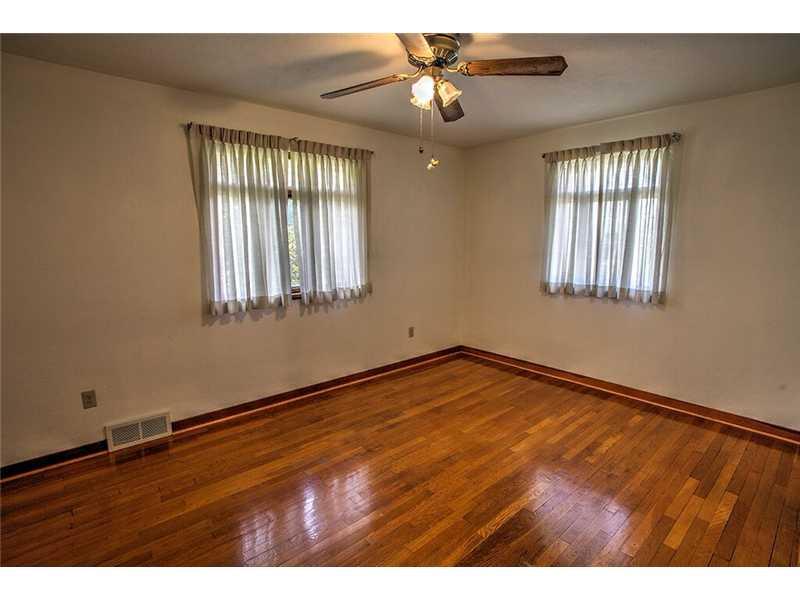 2201 Ridge Road McKeesport, PA 15135 - Photo 11 of 19 Master Bedroom. The front bedroom features hardwood floors and has been freshly painted.