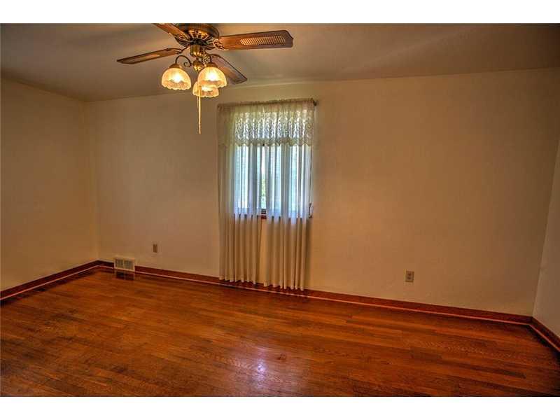 2201 Ridge Road McKeesport, PA 15135 - Photo 12 of 19 Bedroom. The back bedroom also features hardwood floors and has been freshly painted.