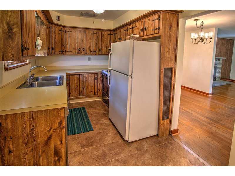 2201 Ridge Road McKeesport, PA 15135 - Photo 4 of 19 Kitchen. The eat in kitchen comes equipped with a refrigerator and an electric stove. The vinyl floor is brand new. Look out over the back yard!