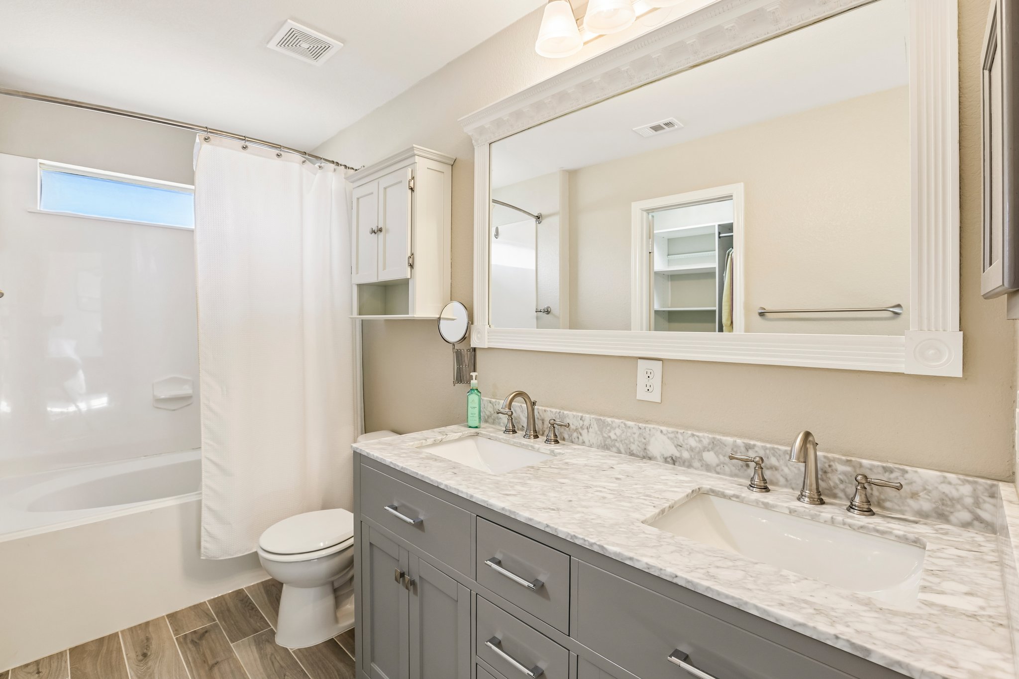 5508 Emma Thompson Way Austin, TX 78747 - Photo 24 of 34 Spacious primary bathroom features a dual vanity and is light and bright.
