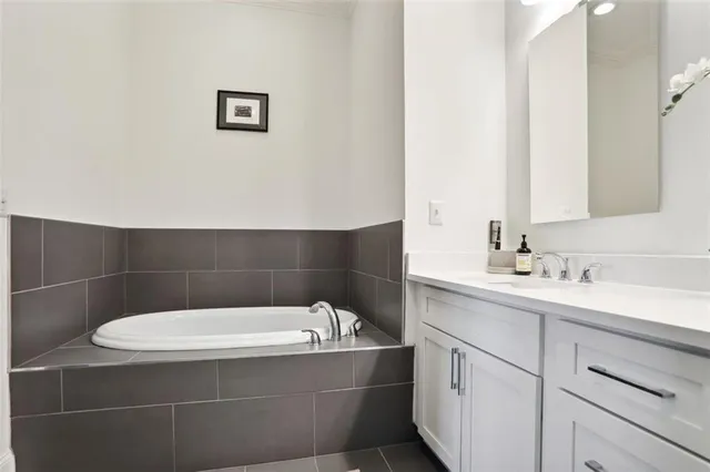 a bathroom with a bathtub and sink