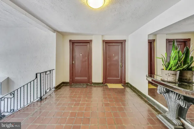 a view of an entryway with wooden floor