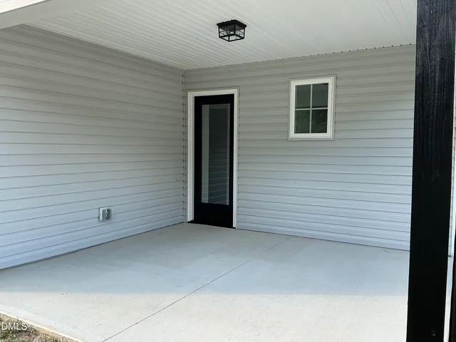 a view of a door and a window
